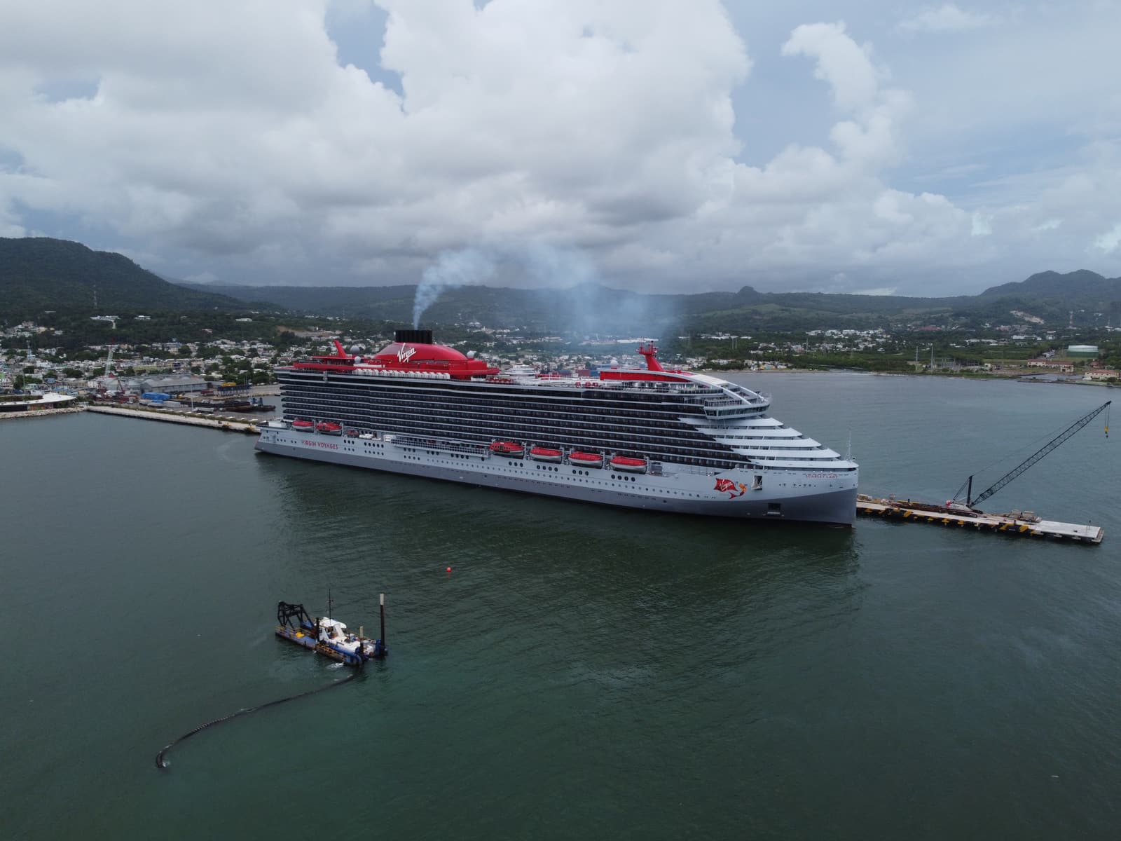 A cruise ship alongside the Taino Bay pier seen from the air